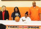 Joy signs to become a Ranger Averyale Joy signs to play basketball for Northwest Mississippi Community College. Pictured (l-r) MHS Principal Darlene Cardwell, Thella Joy (Averyale’s mother), Averyale Joy (seated) and MHS Lady Tiger Head Coach James Burkley