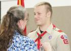 Jenny Vincent pins her son, Joshua Vincent, with the Boy Scout Eagle Award during Saturday’s ceremony.
