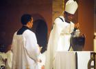 Bishop Terry Steib of the Memphis Diocese of the Catholic Church, mixes the Chrism Oil during the annual Chrism Mass on March 31. The oil will be used by priests within the diocese during confirmation of those entering the Church. 