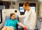 Brianna Gay of Bolivar gives up a pint of blood to Jill Vantrease of Lifeline for the Battle of the Badges blood drove. Gay decided to donate her pint in honor of the Police Department.  