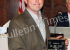 Dr. Ben West receives a plaque from Hardeman County Mayor Jimmy Sain During the October County Commission meeting.