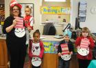 Dr. Seuss day at Middleton Library Those attending Dr Suess day at the Middleton Library were: Cynthia Scott, head librarian, holding Tinayah Joy, Kaliya Joy, Miles Taylor, Anna Watkins.