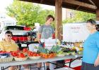 Bill Deen, grandson Houston Bateman and baker/shopper Helen Bourret at the Bolivar Farmers Market on Saturday, June 24.