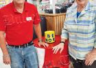 Jimmy Howell, assistant manager of Bolivar’s Food Giant, and Stephanie Middleton recently set up a bin for food donations near the front of the store.