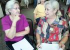 Lona Coffee, left, president of the Grand Valley Lakes Ladies’ Club confers with Wanda Culver, club vice president at the regular monthly board of directors meeting. Coffee reported membership in the Ladies’ Club is now 34.  