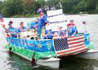 First place trophy in The Grand Valley Lakes Annual Boat Parade went to Jim Gehringer and crew aboard “Happy Birthday America”. Sixteen beautifully decorated boats from jet skis to pontoon boats and everywhere between entered the event. The theme for this year’s parade was “Aloha Grand Valley”. Gehringer’s boat was festooned with a combination of birthday cake, flags, Uncle Sam, lots of red, white, and blue all blended with a Hawaiian motif and Don Ho singing “Tiny Bubbles”.