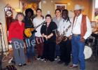  Pictured l-r: Kandy Shackelford, (Chamber of Commerce director), Gerald Thornton (guitar) Alan Maguire (bass), Deborah Turner Brasfield (owner of On the Square Gallery and Gifts), Carl Maguire (drums), Reginald White (saxophone), and Mack Carter,  Hornsby mayor and president of Chamber of Commerce).