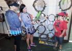 Grand Valley Lakes Ladies Club has successful fundraiser Jennifer Sinclair, Amanda Clutter, and Jayce Clutter (l to r) admire handmade door wreaths offered at the Grand Valley Lakes Ladies Club Annual Yard Sale. The unusual wreaths were fashioned from vines found in the Valley.
