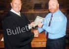 Bolivar City Council Members take oath Bolivar City Judge Steve Hornsby congratulates Councilman Todd Lowe.
