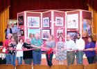 Forest Festival Chairperson Tina Garrison cuts the ribbon to open the 2018 Tennessee Forest Festival in the Luez Theatre, which is hosting the Forest Festival Art Show and Contest.  Photo by Erica Garrison