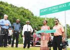 Photo from left to right: Hardeman County Mayor Jimmy Sain, Tennessee State Representative Johnny Shaw, Hicks and children Diane Redditt and James Hicks.  Photo by Ginger Tester.