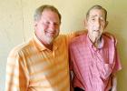 Scholarship to Honor County Teacher Established Chuck Latham (left), president and CEO of Chuck Latham Associates Inc., is pictured with his high school agriculture teacher, Huey Mott, for whom he has named a scholarship at the University of Tennessee at Martin.