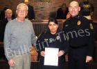 Bolivar Mayor Barrett Stevens presents a letter of recognition to officer Juana “Nelly” Munoz. Photo (l-r) Bolivar Mayor Barrett Stevens, Juana “Nelly” Munoz, Bolivar Police Chief Pat Baker.