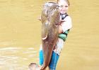 Lydia Sain caught her 40 pound yellow catfish on the Fourth of July. She is the daughter of Junior and Candice Sain.