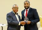 McTizic (right) is pictured accepting the African American Conference Emerging Leader Award from Evelyn Robertson Jr., WestStar class of 1997.