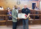 Bolivar Mayor Julian McTizic presents Walley with a silver platter to commemorate his time as a city councilman. 