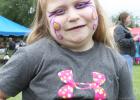 Morgan Bizzell, 6, strikes a pose after getting her face painted.