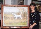 National Field Trial Championship begins at Ames Plantation Tanya Brotherton, Executive Director of the Bird Dog Foundation Inc. unveils a painting of the 2014 Field Dog Champion, Shadow Oak Bo.