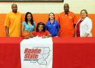 Rachelle Parks signed with Roane State to play basketball on the college level. Pictured are (l-r) Philip Parks (father), Stacey Parks (mother), Rachelle Parks (seated), Monica Bowles (Roane State head coach), James Burkley (MHS Lady Tigers head coach), Darlene Cardwell (MHS Principal).