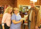 Pine Meadows donated canned food items and non-perishables to Loaves and Fishes, along with $250, as a result of their annual Thanksgiving food drive with families of their residents. Pictured (l-r) Sharon McKeen (Director of Marketing and Admissions), Connie Pritchard (Director of Nursing) and Ken ‘Bo’ Lain (Loaves and Fishes administrator)
