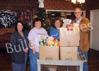 Staff members at Pine Meadows Healthcare present $250 and more than 150 cans of food to Loaves and Fishes. Pictured (l-r): Barbara Gammel activities director, Reba Weaver PBC/AP, Glenda McCartney administrator, Bo Lain administrator of Loaves and Fishes.