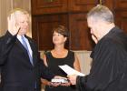 Jimmy Sain, with his wife Kim holding the Bible by his side, is sworn in as mayor of Hardeman County by Judge Charles ‘Chip’ Cary.