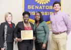 Congratulating Taylor left to right are, Robin Douglas, assistant dean of Career, Technical and Workforce Education; her mother Tessie Williams and Scott Crockett, Rotary club president. 