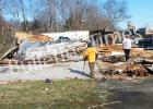 Hardeman County Sheriff John Doolen surveys the damage brought about by the tornado that touched down along Highway 125 near the Tennessee/Mississippi line. The demolished building behind Doolen was a convenience store which had been closed. Photo by Bill Stone