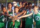 The BMS Tigers celebrate after their win at Thursday’s cross country meet