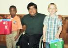 Winners from Hardeman County’s Bolivar Elementary are pictured from(l-r):First grader, Kentravius Blakemore, who won second place; Art  Instructor Louie Bucud; and Colton Patnaude, who won third place in Kindergarten.