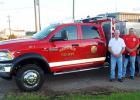 Whiteville Fire Department Chief Ernie Burkeen, Raymond Perry, Secretary Tonya Perry and John Swarey with the department’s new brush truck.