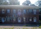 Bill Garrett Jr. was denied a Certificate of Compliance for a proposed liquor store at 111 S. Water Street because the building is currently divided into three areas. There must be at least 1,000 square feet of retail according to the liquor ordinance.