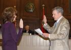 Connie Young was sworn in by Charles "Chip" Cary as County Commissioner on Tuesday, March 17, after being unanimously voted in by the commission to complete her son, David Young's, term in office after David passed away in February. Article Image Alt Text
