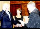 Jimmy Sain, with his wife Kim holding the Bible by his side, is sworn in as mayor of Hardeman County by Judge Charles ‘Chip’ Cary.