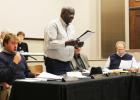County Commissioner Elmer Cobb Jr. reads a Resolution to urge the Board of Education to require the Pledge of Allegiance to be recited daily and a Moment of Silence to be held each day in the schools. 