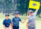 Daniel, far left, poses with the flagstick and his fellow competitors at Talamore.