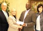 Helping provide literacy for 10 years Pictured (l-r): First South Community Bank President Larry Crawford, Vice President/Branch Manager Lora Moore, Vice President of Hardeman Co Imagination Library Monroe Woods, Representative Cathy Mayfield