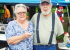 Pictured Bonnie Callahan, representing the Middleton Civitan Club presents a check to Bud Harris to help with his medical bills.