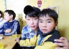 Two young boys from the Hope Center, located at the city dump, pose for a photo while enjoying some of the services and ministries provided by Harbor Evangelism. 