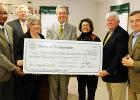 Hargett Brings a Big Check Photo left to right: Representative Shaw, Hardeman County Mayor Jimmy Sain, Grand Junction Library Director Wanza Taylor, Secretary of State Hargett, Senator Gresham, Grand Junction Mayor Curtis Lane, and Representative Gant.