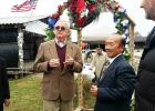 Photo courtesy of Keng Vang. Bolivar Mayor, Barrett Stevens and Hmong Elder, See Sun Vu, each offered blessings to those passing through the “Gate to the Pathway of the Future” at the Hmong New Year celebration Saturday, November 7.  	