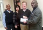 Just imagine……. Former County Mayor Willie Spencer, Imagination Library liaison Cathy Ledbetter, Merchants and Planters Bank President Tommy Sain, and Imagination Library Vice President Monroe Woods (l-r) are pictured at presentation of the Bank’s tenth annual donation to the Library.