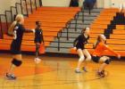 MHS back row specialist, Kayleigh Lanier prepares to receive the serve from Madison at Tuesday night’s game. Pictured (l-r): Haley Maccarino, Talandra Sain (line judge), Chloe Kardenas and Kayleigh Lanier. Lanier has proved to be a valuable asset for the Lady Tigers contributing to both JV and Varsity teams.