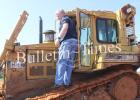 Hardeman County Mayor Jimmy Sain took to the bulldozer Saturday as he pushed dirt over the exposed and uncovered bailed garbage to correct the non-compliance with the laws. 