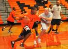 Former MHS basketball players Sherman Valentine (left) and Brent Dawkins (right) compete in the MHS Alumni Games.