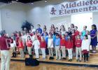 Middleton Elementary honors nation’s veterans The Third and Fourth Grade students and teachers of Middleton Elementary School presented a stirring musical program to honor our veterans. Under the direction of Andrew Proctor, the students sang several patriotic songs. They honored each veteran in attendance as they sang the official hymn of each branch of military service.