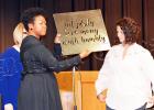 Bolivar Central football honored Nicka Smith (center) for her service to the team, giving her the title of “team mom.” Smith is the wife of Bolivar Offensive Coordinator RaShad Smith and takes photographs for the Bulletin Times and the weekly game programs. Photo by Zaneta Lowe.