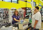 Pictured (l-r) are cashier Amber Bailey assisting customer Carla Vaughn.