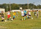 HRAYS soccer league clinic participants practice kicking in the perfect score against the goalie.