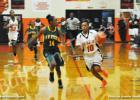 MHS Lady Tiger Sequoya Warren takes the ball down the court for the point against H.W. Byers.